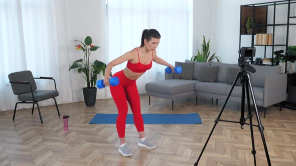 Sport Muscular Girl Trains Teaches Student Records Online Master Class on Camera alt
