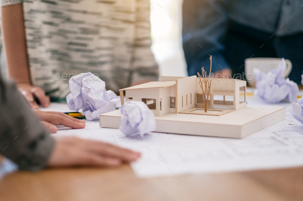 an architect feel stressed after working on architecture model together with shop drawing paper