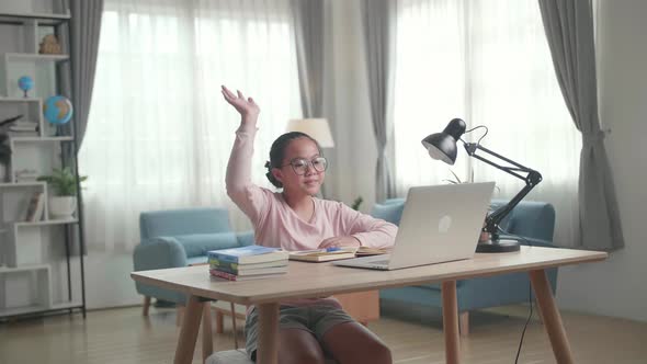 Teenage Girl Learning Online From Laptop, Raising Hand Distance Learning Online alt