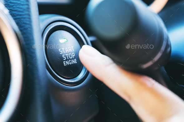 Closeup image of a finger pressing on a start stop engine button in a car  Stock Photo by Farknot