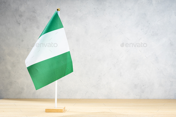Nigeria table flag on white textured wall - Stock Photo - Images