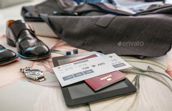 Business travel preparations with boarding pass - Stock Photo - Images