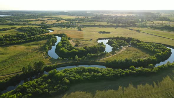 Countryside. A Wide Riverbed, Flowing Between Fields And Forests