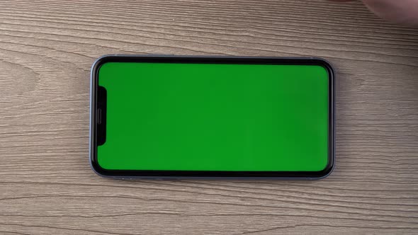 Smartphone with Green Screen Mockup Swipe Scroll Hand Close Up Mobile Phone User