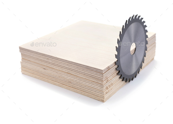 Plywood boards isolated and circular saw blade at white background. Stack of plywood pieces