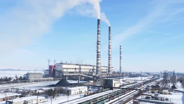 Aerial view of old thermoelectric plant with big chimneys in a rural landscape alt