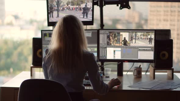 Video Editor Work On Footage In Post Production Studio.Videographer On TV Station Broadcasting alt