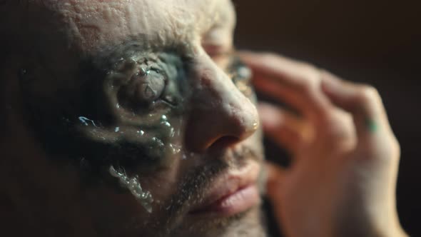 Close Up of Makeup Artist Giving Actor Zombie Makeover Before Filming alt