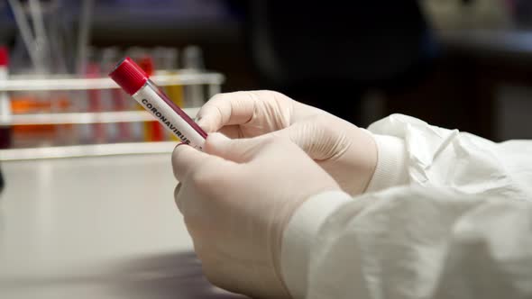 Scientist Holding Coronavirus Test Tube