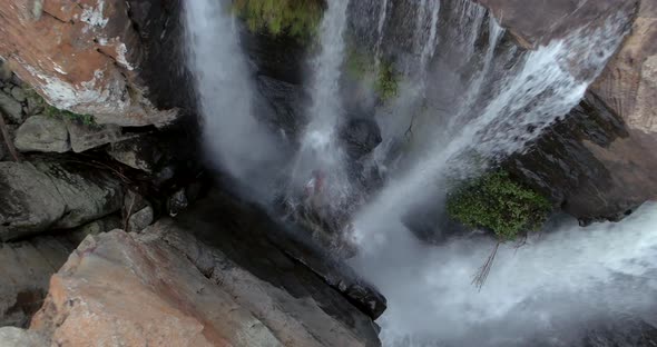 Aerial: Beautiful top down view of waterfall streams rapidly flowing and falling down. Mpumalanga, S alt