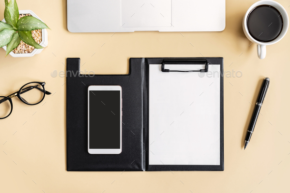 Empty screen Smart phone and file folder on business desk office with copy space, Top view