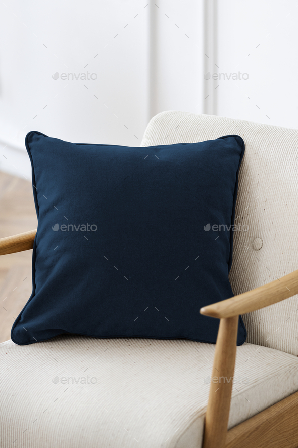 Minimal velvet cushion cover in blue on an armchair