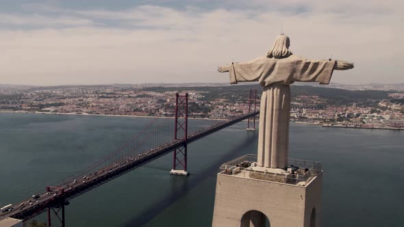 Christ the King, symbol of peace overlooking Lisbon capital city, aerial shot. alt