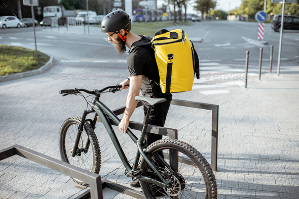Man delivering food with thermal bag on a bicycle