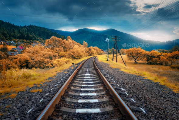 Rural railroad in mountains in overcast day. Old railway - Stock Photo - Images