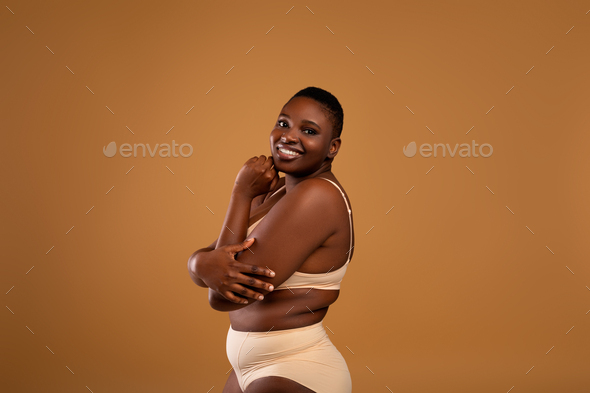 You Are Beautiful. Portrait Of Curvy Black Woman In Underwear Stock Photo  by Prostock-studio