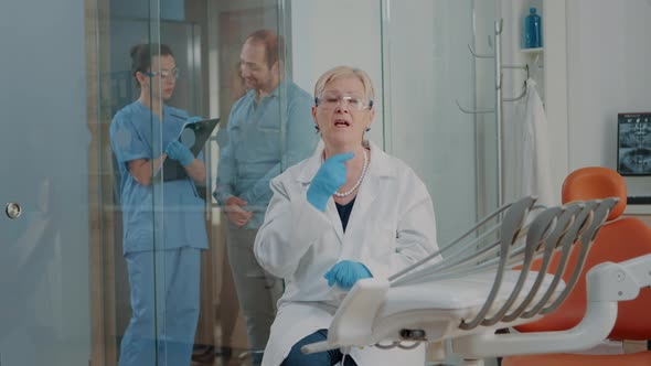 POV of Dentistry Expert Using Online Video Call to Give Stomatological Advice alt
