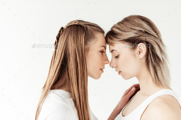 Beautiful Lesbian Couple Standing Face To Face And Going To Kiss