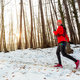 Woman Running Through Woods in Winter. - PhotoDune Item for Sale