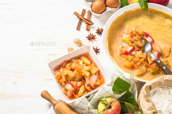 Apple pie with ingredients for cooking top view - Stock Photo - Images