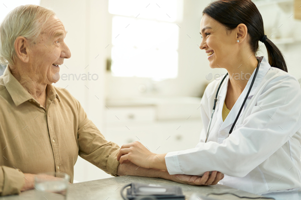 Friendly doctor getting along well with her elderly patient