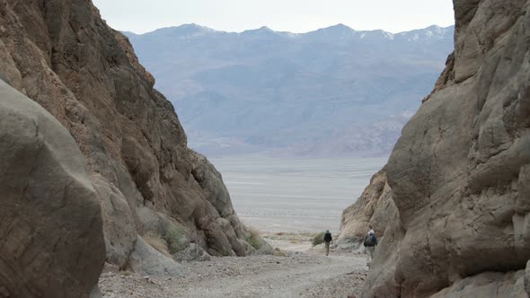 Two hikers exit Titus Canyon - Death Valley National Park alt