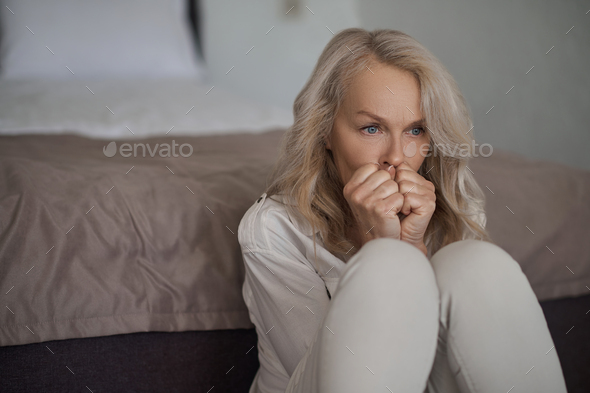 Serious Caucasian depressed lady lost in thought