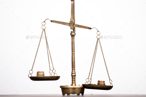 Money weighing on justice scale. Payment balance and tax - Stock Photo - Images