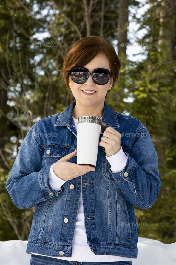 Travel mug mockup of a woman in sunglasses, model mockup