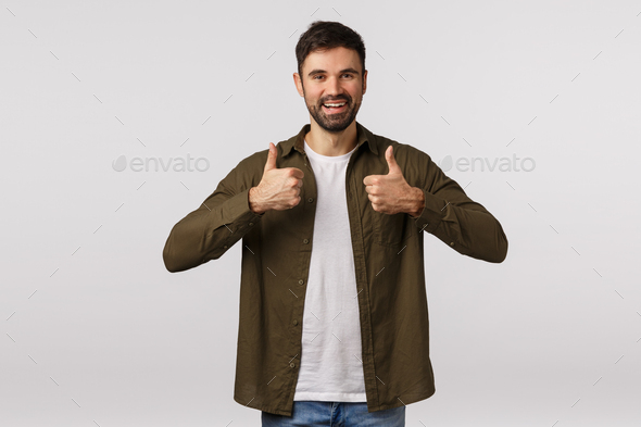 Good idea, supportive friend encourage take action, like idea. Attractive bearded man in coat, show