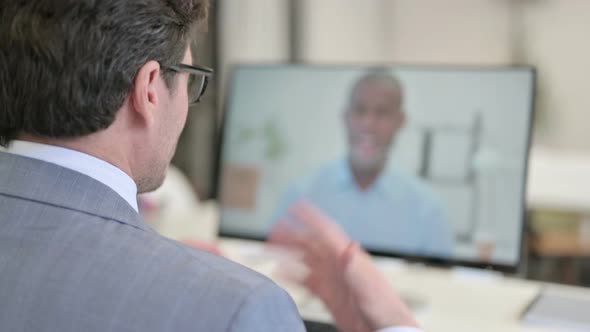 Businessman Talking on Video Call on Desktop alt