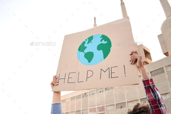 Help me poster claim during a street protestor for climate change.