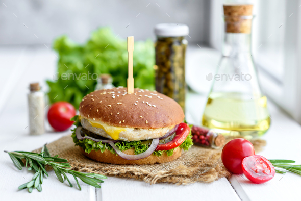 Delicious fresh homemade burger on a wooden table