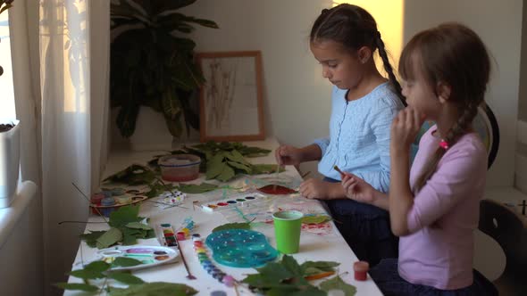 Two Schoolgirls Draw Leaves Girls Paint Autumn Leaves