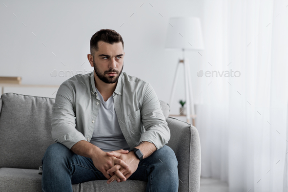 Feeling anxious, sorrow and unpleasant pain, suffering depression, human emotions, facial expression - Stock Photo - Images