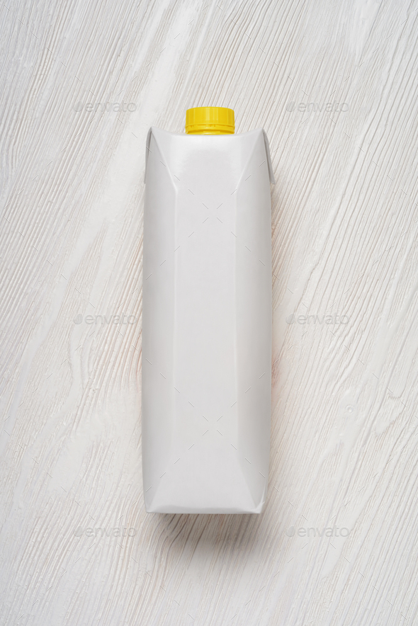 Blank white carton package on wood table. Mock-up template.