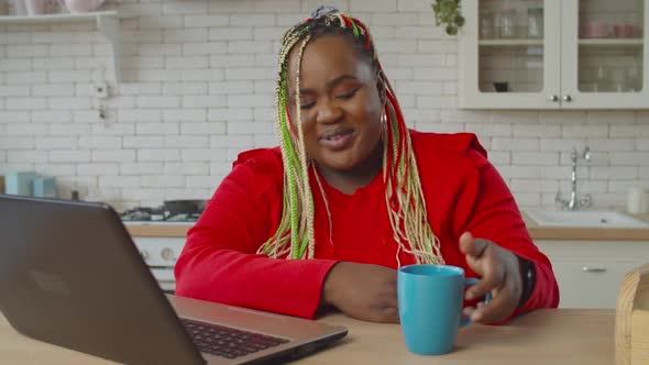 Female Enjoying Entertainment Content on Laptop alt