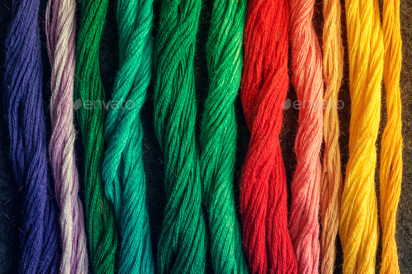 Bright multicolored embroidery thread yarns. Skeins of
