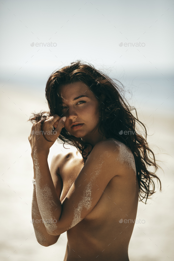 Portrait of Tanned Naked Woman on the Beach
