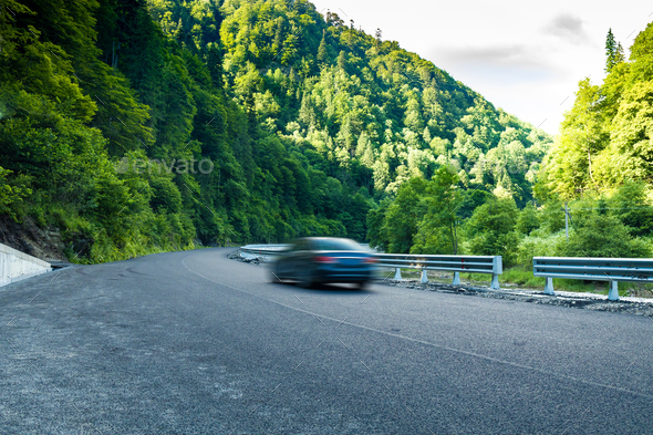 Rental car moving fast on the autobahn - Stock Photo - Images