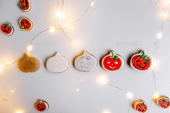 DIY Step by step instructions on how to draw an orange pumpkin shaped gingerbread cookie using icing