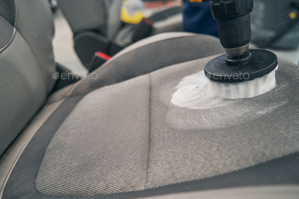 Closeup dry cleaning of car seat fabric with high-pressure cleaner Stock  Photo by svitlanah