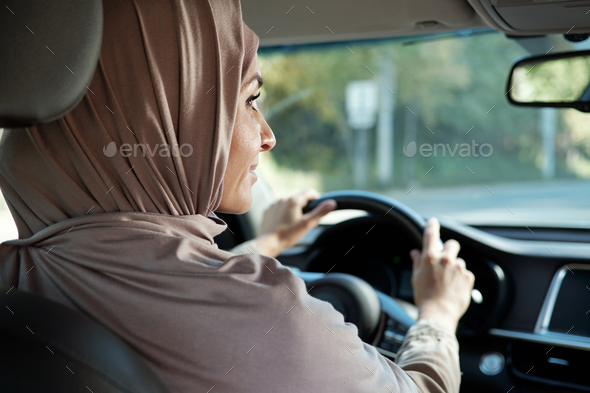 Woman In Hijab Driving Car