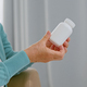 Mature woman patient takes blank white bottle of medicine from doctor - PhotoDune Item for Sale