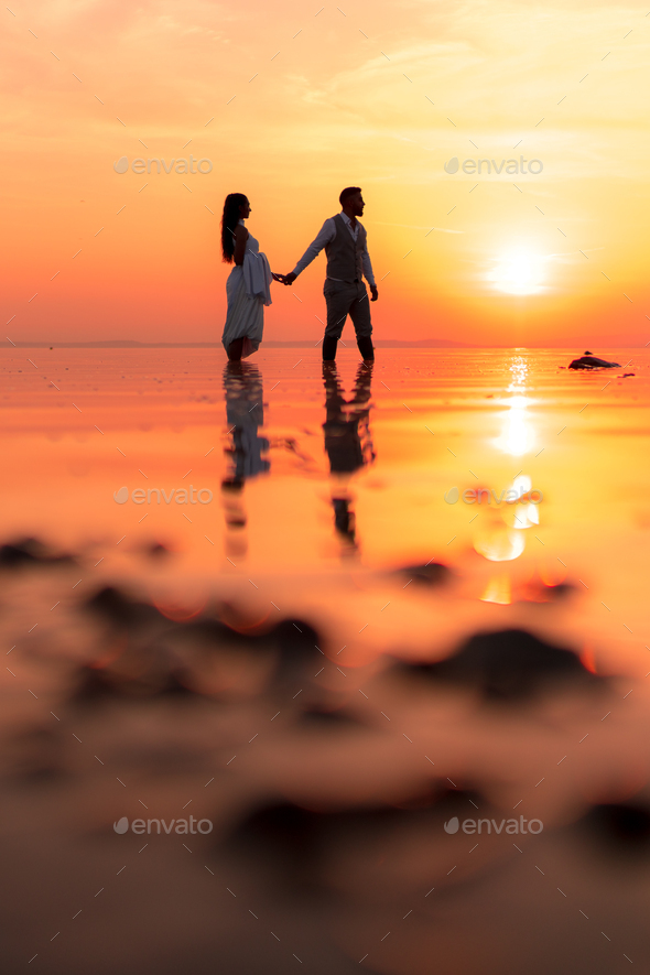 Couple Romantic Love Moment During Sunset On A Lake Stock Photo, Picture  and Royalty Free Image. Image 15391006.