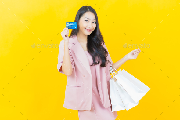Portrait beautiful young asian woman smile with shopping bag - Stock Photo - Images