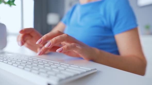 Woman Typing on a Computer Keyboard. Concept of Remote Work. alt