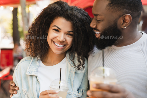 African-american romantic couple having romantic date, drinking ...