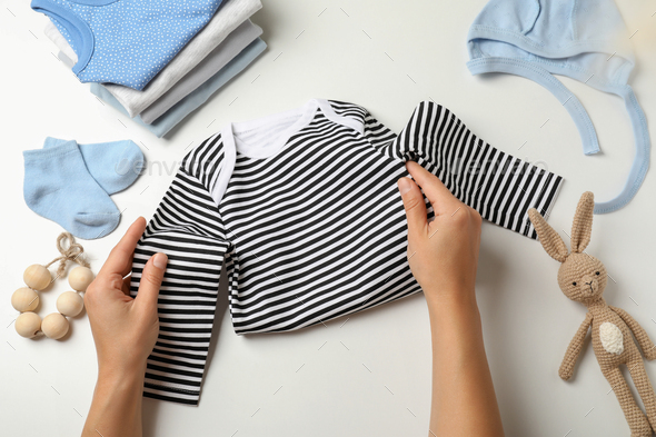 Laundry accessories on white table against blue background Stock Photo by  AtlasComposer