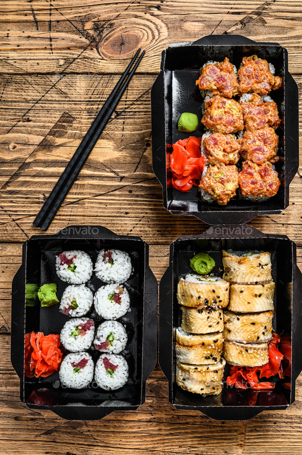 The sushi rolls in the delivery package, ordered in sushi take-out restaurant.
